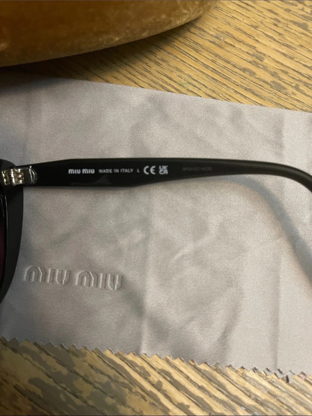Miu Miu Black Cat-Eye Sunglasses with Dark Lenses